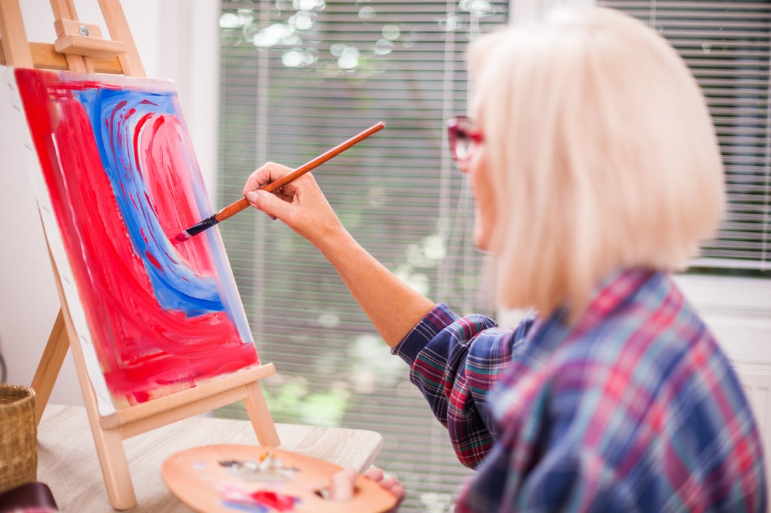 Senior woman art painting